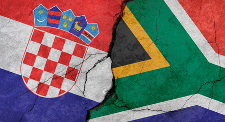 Croatia and South Africa flags, concrete wall texture with cracks, grunge background, military...