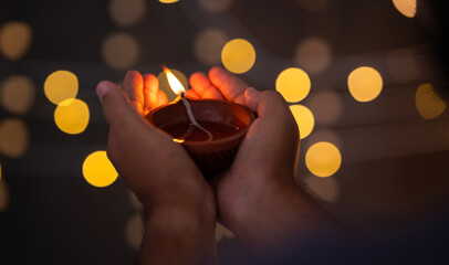 Hand holding Diwali Diya lamp, Happy Diwali banner type image