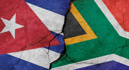 Cuba and South Africa flags, concrete wall texture with cracks, grunge background, military conflict concept