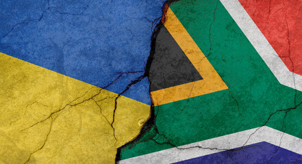 Ukraine and South Africa flags, concrete wall texture with cracks, grunge background, military conflict concept