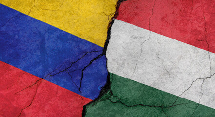 Flags of Venezuela and Hungary texture of concrete wall with cracks, grunge background, military conflict concept