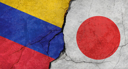 Venezuela and Japan flags texture of concrete wall with cracks, grunge background, military conflict concept