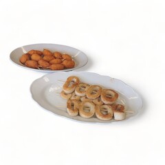 Creamed cuttlefish skewers on a serving plate-