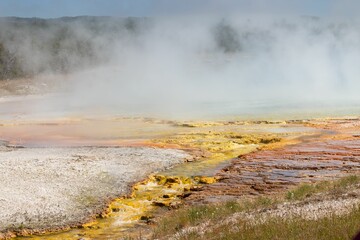 Geologized geogrid crater filled with a large body of calm, blue water