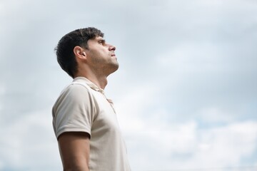 Man lookung in sky and thinking background