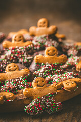 Sweet christmas cookies, gingerbread, on a dark wooden table