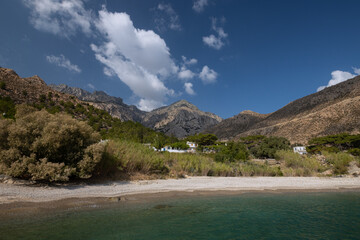 Gorgeous view to the naturalo beauty of Trapalou beach embedded in giant mountain range.