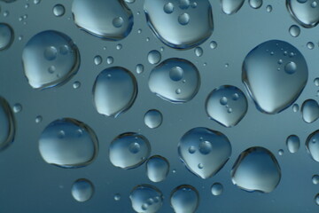 The glass surface is adorned with numerous shimmering water droplets