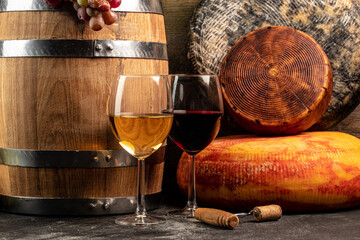 Cheese wheel and wine on a wooden background. farmer market. place for text