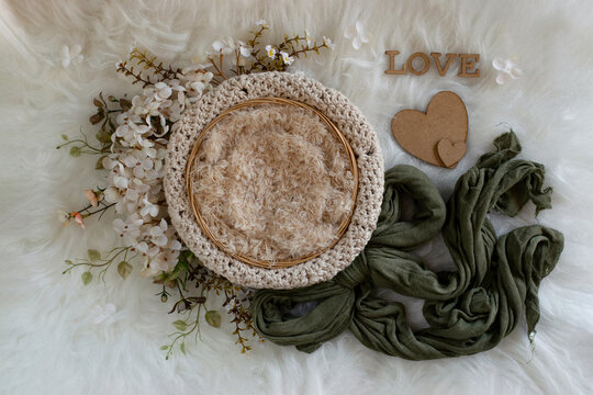 Newborn digital backdrop with handmade flowers, basket with crochet, ribbon and word love. Newborn background. top view. 