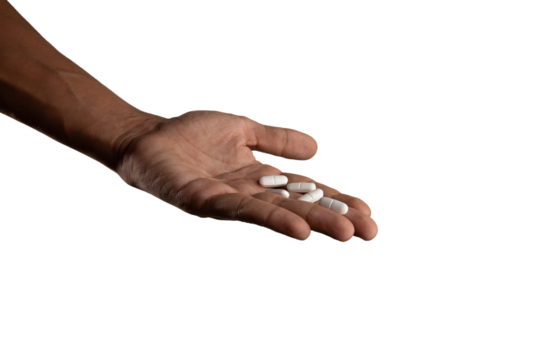 Black male hand holding pills isolated mental health concept
