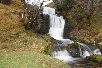 Fototapeta premium Eadar A' Chalda Waterfall on Allt a' Chalda Beag near the Ruin of 16th Century Ardvreck Castle, Loch Assynt, Sutherland, Scotland, UK