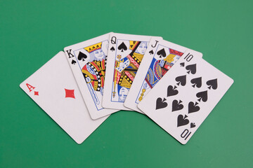 Playing cards. Gambling, bridge, poker concept. Sport equipment.Green background.