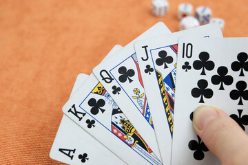 Playing cards in hand. Gambling, bridge, poker concept. Sport equipment.