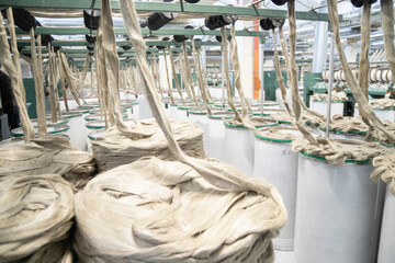 Industrial loom on textile .Flax processing plant, fabric production. Flax is made .A workshop at a...