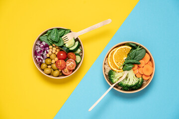 Takeaway food salads Buddha bowl in round cardboard containers. Mediterranean, with broccoli and quinoa, kale and chickpeas bowls. Top view on bright background