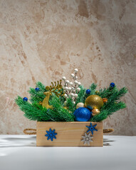 Layout of New Year's toys, accessories, gifts on a light wooden background. New Year background.