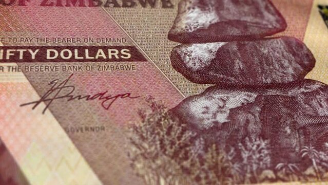 Zimbabwe Zimbabwean Dollar 50 Banknotes, Fifty Zimbabwean Dollar, Close-up and macro view of the Zimbabwean Dollar, Tracking and Dolly Shots 50 Zimbabwean Dollar banknote Observe and Reserve Side