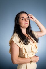 Young business woman with hand on head. 