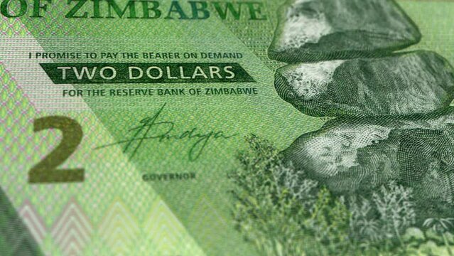 Zimbabwe Zimbabwean Dollar 2 Banknotes, Two Zimbabwean Dollar, Close-up and macro view of the Zimbabwean Dollar, Tracking and Dolly Shots 2 Zimbabwean Dollar banknote Observe and Reserve Side