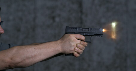 Close-up pistol Stoeger STR-9 Striker Fired 9mm, single shot at shooting range in super slow-motion...