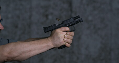 Close-up pistol Stoeger STR-9 Striker Fired 9mm, single shot at shooting range in super slow-motion...