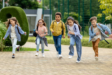 Happy kids running at the school yard
