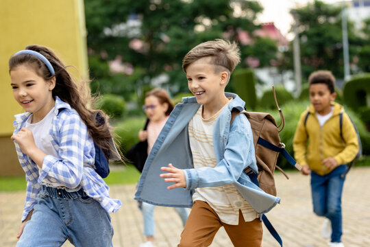 Happy kids running at the school yard