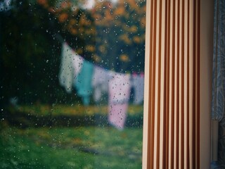 Washing hung out on line in rainfall 