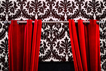 A Captivating Moment: The Red Curtain Unveiling a Monochrome World