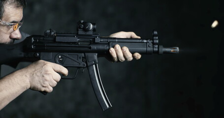 High-Speed Shooting with HK SP5K Assault Rifle, Side Perspective of Person Aiming and Firing