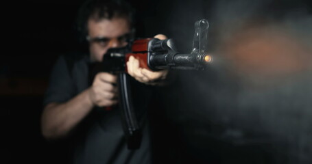 Man aiming with Kalashnikov Weapon firing in super slow-motion at high-speed 800 fps, AK-47 Rifle...