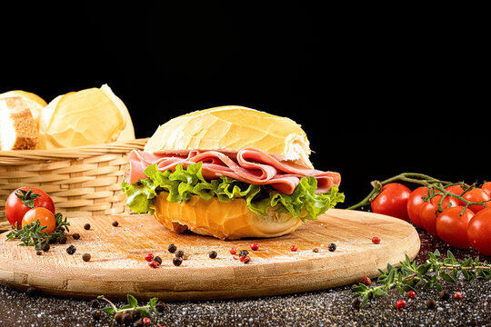 Brazilian bread sandwich with mortadella. Traditional pork snack served in bakeries in Brazil, french bread with bologna