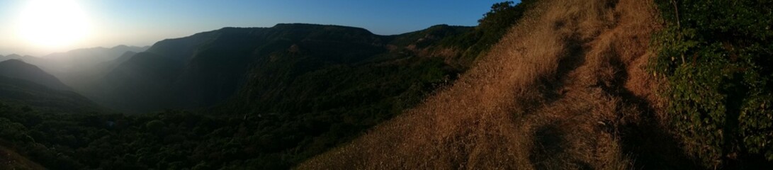 Panorama. Sunset on a mountain's view point in India. Maharashtra State. Wildlife.