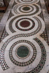 Cosmatesque floor at the central nave of the Basilica of Santa Maria in Trastevere, Rome, Italy