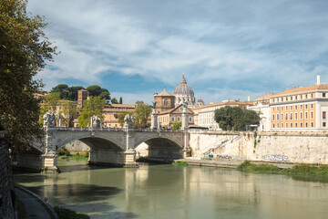 Roman cityscape with the Tiber, the bridge Ponte Vittorio Emanuele II and the dome of Saint Peter's Basilica, Rome, Italy
