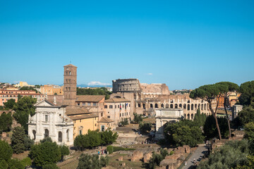 Fototapeta na wymiar Panorama with the Roman Forum, the Colosseum and the Basilica di Santa Francesca Romana as seen from the Palatine hill, Rome, Italy