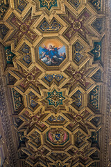 Ceiling with geometric pattern and painting of Domenichino in the Basilica of Santa Maria in Trastevere, Rome, Italy
