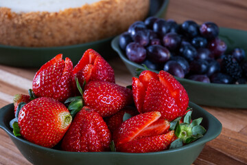 sweet pie to be covered with red fruits, not yet ready