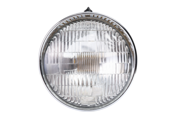 Old vintage motorcycle headlight isolated on white background.