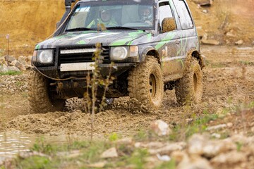 offroad car driving on track in dirt. adventure offroad racing