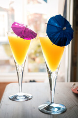 Cocktails on a table, with little umbrellas