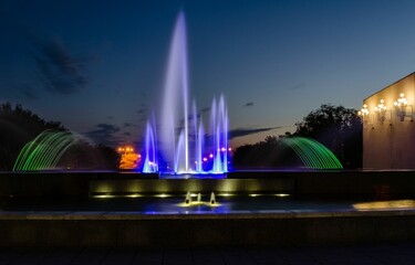 Colorful illuminated fountains at night. Karaganda, Kazakhstan.