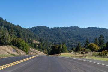 Highway 101, Image shows the highway and the beautiful countryside views on a hot clear day from the mountain to the forest scenery, October 2023
