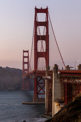 golden gate bridge at sunset, image shows the 2737 meter long bridge built in 1937 on a warm evening with clear skies showing a array of sunset colours, taken october 2023 © J.Woolley
