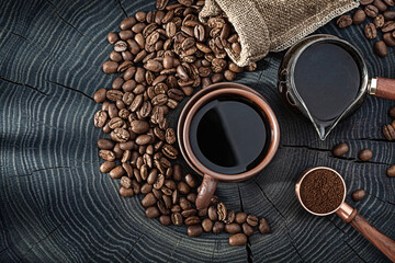 Coffee Drink Beans And Ground In Composition On Vintage Wood Background.
