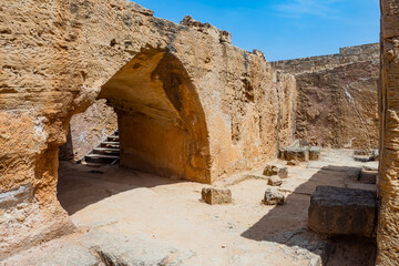 Cyprus necropolis. Paphos panorama. Stone arch in archaeological park tombs of kings. Necropolis in city Paphos. Excursions around Cyprus. Sights of Paphos. Trip to Cyprus. Mediterranean attractions
