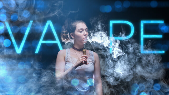 Woman vaper. Vape logo near girl. Female student with electronic cigarette. Vaper stands in cigarette smoke. Vape hobby. Alternative cigarettes. Woman vaper blowing smoke from her mouth