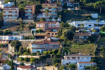 Fototapeta premium Houses build on the slope of a mountain hill in Catalonia, Spain