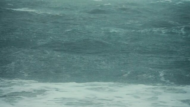 A spring medium-strength storm on shallow Sea of Azov. The barrier beach Arabatskaya Strelka stretches for 100 km. Incoming wave, strong wind